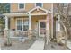 Inviting front porch featuring stone accents and a 'Welcome' sign, creating a warm entry at 15612 E 96Th Way # 29A, Commerce City, CO 80022