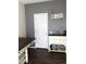 Hallway featuring a decorative wall display with a charming white cabinet for storage and grey accent wall at 15612 E 96Th Way # 29A, Commerce City, CO 80022