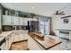 Charming kitchen features a wooden center island, stainless steel appliances, and sliding glass doors at 15612 E 96Th Way # 29A, Commerce City, CO 80022