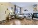 Inviting living room featuring a comfortable sectional sofa, fireplace, and ample natural light at 15612 E 96Th Way # 29A, Commerce City, CO 80022