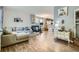 Spacious living room with hardwood floors, a fireplace, and stylish decor, perfect for relaxation at 15612 E 96Th Way # 29A, Commerce City, CO 80022