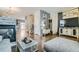 Open-concept living space with a fireplace, modern decor, and hardwood floors, ideal for entertaining at 15612 E 96Th Way # 29A, Commerce City, CO 80022