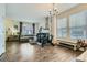 Bright and spacious living room with a cozy fireplace, large windows, and hardwood flooring at 15612 E 96Th Way # 29A, Commerce City, CO 80022