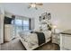Serene main bedroom featuring a plush bed, neutral tones, and bright natural lighting at 15612 E 96Th Way # 29A, Commerce City, CO 80022
