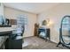 Well-lit office space with modern desk and carpet flooring at 15612 E 96Th Way # 29A, Commerce City, CO 80022