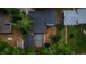 Aerial view of the property featuring a well-maintained backyard, patio, and lush greenery, creating a private oasis at 3545 Moorhead Ave, Boulder, CO 80305