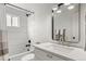 Bright bathroom features a shower/tub combo, modern fixtures, and a stylish vanity with ample counter space at 3545 Moorhead Ave, Boulder, CO 80305