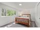 Cozy bedroom with a large window providing natural light and comfortable furnishings at 3545 Moorhead Ave, Boulder, CO 80305