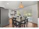 Bright dining area featuring a modern chandelier and sliding glass doors to the backyard at 3545 Moorhead Ave, Boulder, CO 80305