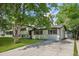 A charming two-story home with a lush green lawn and mature trees at 3545 Moorhead Ave, Boulder, CO 80305