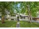 Charming two-story home with beautifully landscaped front yard and mature trees at 3545 Moorhead Ave, Boulder, CO 80305