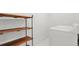 Bright laundry room with built-in shelving and modern appliances at 3545 Moorhead Ave, Boulder, CO 80305