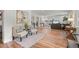 Open-concept living room with hardwood floors, neutral decor, and ample natural light at 3545 Moorhead Ave, Boulder, CO 80305