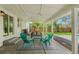 Cozy covered patio decorated with outdoor furniture, string lights, and a stylish rug creating a relaxing outdoor space at 3545 Moorhead Ave, Boulder, CO 80305