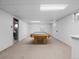 Spacious basement featuring a classic billiard table and neutral carpeting for a comfortable and inviting space at 4779 S Owens Way, Littleton, CO 80127