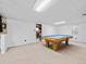 Basement game room with a classic pool table and neutral carpet flooring at 4779 S Owens Way, Littleton, CO 80127