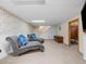 Finished basement featuring stylish lounge chairs, and recreational space at 4779 S Owens Way, Littleton, CO 80127