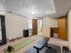Functional basement space with exercise equipment next to closet and built-ins at 4779 S Owens Way, Littleton, CO 80127