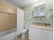 Cozy bathroom featuring a vanity, tiled shower, and neutral color palette at 4779 S Owens Way, Littleton, CO 80127