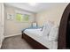 Inviting bedroom with a queen bed, soft carpet, and large picture window at 4779 S Owens Way, Littleton, CO 80127