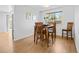 Cozy dining room with a wooden table set and natural light from a window at 4779 S Owens Way, Littleton, CO 80127