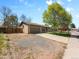 Charming single-story home featuring a well-maintained lawn, large shade tree and an attached two-car garage at 4779 S Owens Way, Littleton, CO 80127