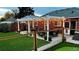 Spacious backyard with pergola, patio, and string lights at 2686 Poplar St, Denver, CO 80207