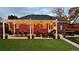 Cozy backyard patio with pergola, seating, and artificial turf at 2686 Poplar St, Denver, CO 80207