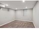 Unfinished basement room with neutral wall paint and carpet at 2686 Poplar St, Denver, CO 80207