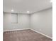 Unfinished basement room with neutral wall paint and carpet at 2686 Poplar St, Denver, CO 80207