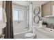 Updated bathroom with subway tile, bathtub, and modern vanity at 2686 Poplar St, Denver, CO 80207