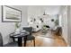 Small dining area with modern table and chairs, overlooking living room at 2686 Poplar St, Denver, CO 80207