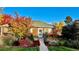 Brick home with well-manicured landscaping and walkway at 2686 Poplar St, Denver, CO 80207