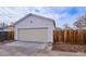 Detached garage with double doors and ample parking space at 2686 Poplar St, Denver, CO 80207