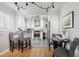 Modern kitchen featuring stainless steel appliances and breakfast bar at 2686 Poplar St, Denver, CO 80207