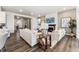 Bright living room with hardwood floors, a fireplace, and comfortable modern furniture at 16655 W 93Rd Pl, Arvada, CO 80007