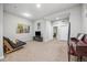 Open finished basement area with access to a window, doors, and natural light at 1857 W 67Th Pl, Denver, CO 80221