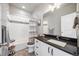 Clean bathroom with a shower-tub, modern vanity, and neutral decor at 1857 W 67Th Pl, Denver, CO 80221