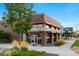 The commercial building features contemporary architecture and inviting storefront entrances for retail and office spaces at 1857 W 67Th Pl, Denver, CO 80221