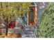 Cozy front porch entrance with plants and landscaping near the front door at 1857 W 67Th Pl, Denver, CO 80221