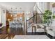Open-concept living space showcasing the kitchen and a staircase with a decorative plant at 1857 W 67Th Pl, Denver, CO 80221