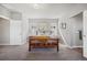 Spacious main bedroom with a sliding barn door and carpet flooring at 1857 W 67Th Pl, Denver, CO 80221