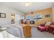 Well-lit main bedroom showing a fireplace and a view of the bathroom at 1857 W 67Th Pl, Denver, CO 80221