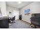 Home office space with modern gray carpet, a bright window, and home office furniture at 1857 W 67Th Pl, Denver, CO 80221