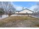 Spacious backyard enclosed by a wooden fence, offering privacy and room for outdoor activities at 4552 S Buckley Way, Aurora, CO 80015