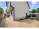 Home's backyard features a wooden deck, an additional entry, and a private fenced area at 250 Cypress Ln, Broomfield, CO 80020