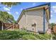View of home's siding, backyard lawn, and a wooden fence for privacy at 250 Cypress Ln, Broomfield, CO 80020
