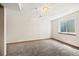 Clean and carpeted basement space featuring natural light and potential for customization at 250 Cypress Ln, Broomfield, CO 80020