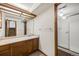 Spacious bathroom featuring vanity with mirror and glass enclosed shower at 250 Cypress Ln, Broomfield, CO 80020