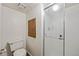 Compact bathroom has a walk-in shower with sliding glass doors at 250 Cypress Ln, Broomfield, CO 80020